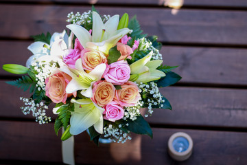 wedding rings and  bouquet of flowers