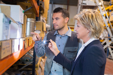 workers using a torch in a warehouse