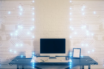 Computer on desktop in office with technology theme hologram. Double exposure. Tech concept.