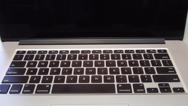 4336 - Man Typing the Letter M Key on Laptop Computer