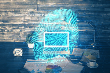 Computer on desktop in office with finger print drawing. Double exposure. Concept of business data security.