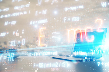 Desktop computer background and formula hologram writing. Double exposure. Education concept.