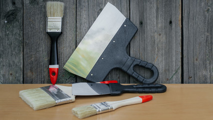 Tool for painting work. Spatula and brushes. Set of items for repair. Top view of a builder with a...