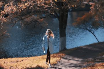 walk in autumn park / beautiful girl in autumn park, model female happiness and fun in yellow trees  October