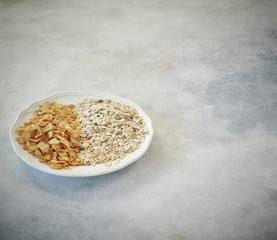 nuts in the plate and up concept, marble grey background.