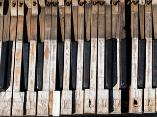Broken keys of an old piano closeup