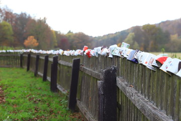 fence decorated with cups in the autumn
