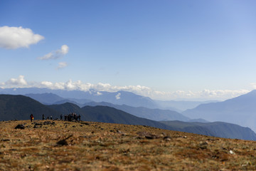 group of people with mountain landscape