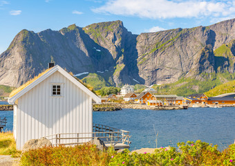 Famous tourist attraction Hamnoy fishing village on Lofoten Islands, Norway with red rorbu houses.