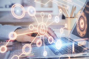 Social network theme hologram with businessman working on computer on background. Concept of world wide web. Multi exposure.