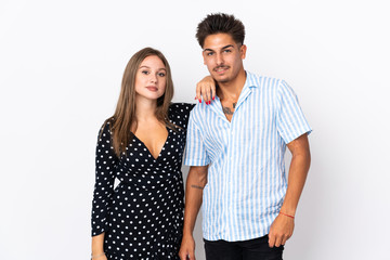 Young caucasian couple isolated on white background happy and laughing