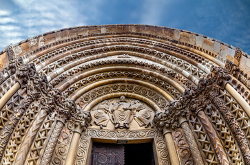 The ornate entrance to the 13th century Romanesque church in Jak, Hungary. © andibandi