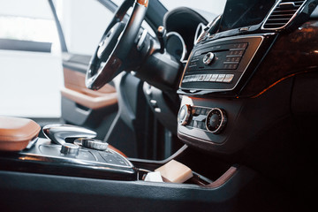 Fototapeta na wymiar Inside of brand new modern black automobile. Front control panel