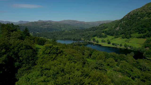 4K:  Drone Aerial Clip of Rydal Water Lake in the English Lake District, Cumbria, UK. Circular shot in Summer with Blue Sky. Stock Video Clip Footage