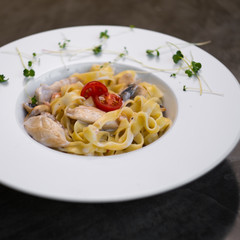 spaghetti with chicken in a creamy sauce
