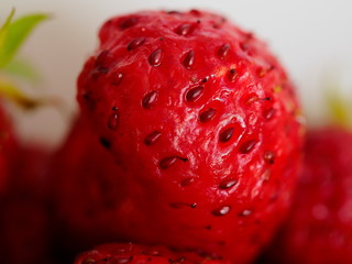 red strawberry berry in the garden close up