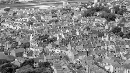 Isle of Portland, Dorset, England (UK) - 15th of May 2014: Panoramic view on high density housing in Fortuneswell village in black nad white tones