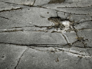 Volcanic rock background with cracks and salt puddle