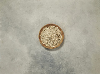 nuts in the plate and up concept, marble grey background.
