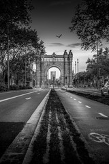Fototapeta na wymiar Streets of Barcelona. Triumph arch. in black and white. fine art