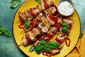Grilled chicken kebab with vegetable and yogurt sauce. Top view with copy space.