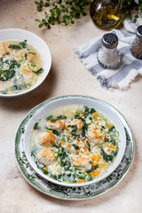 Italian wedding soup with meatballs and ptitim paste