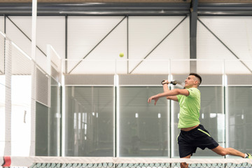 Obraz na płótnie Canvas paddle tennis indoors training man