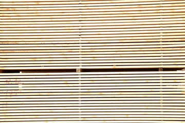 worked wooden boards stacked in a sawmill near Brunico. south tyrol, italy.