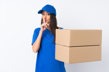 Young delivery woman over isolated white background doing silence gesture