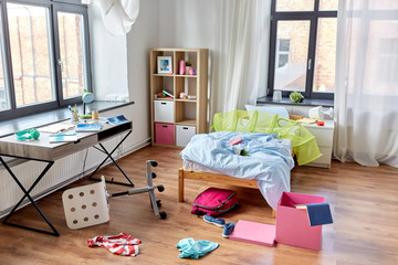 mess, disorder and interior concept - view of messy home kid's room with scattered stuff