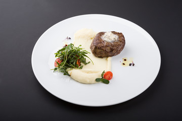 Fried beef steak served with mashed potatoes