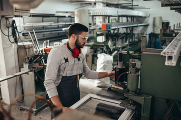 PVC industry worker making PVC frames for windows and doors