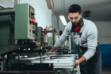 PVC industry worker making PVC frames for windows and doors