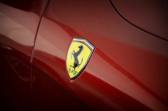 Ferrari Logo on Sport Car in the paddock of Mugello Circuit. Ferrari S.P.A. is an Italian luxury sports car manufacturer, founded by Enzo Ferrari.