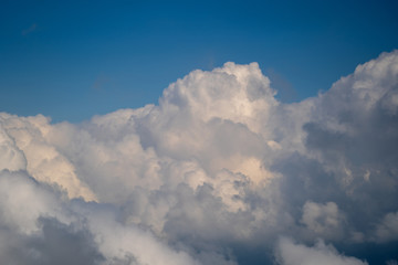 White clouds and blue sky, a view from airplane window