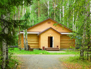 Wooden house in the forest for relaxation.
Small resort wooden house.
Wooden hut in a pine forest.