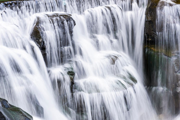 Fototapeta na wymiar Close-up of the waterfall, natural background