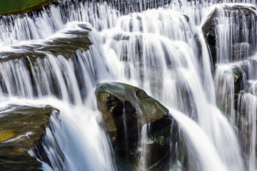 Fototapeta na wymiar Close-up of the waterfall, natural background