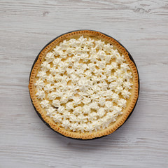 Homemade Tasty Banana Cream Pie on a white wooden surface, top view. Flat lay, overhead, from above.