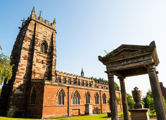 The Grade II listed memorial tomb (right) of William Beeston, a local surgeon who died in 1846, in the grounds of St Mary’s Church in Market Drayton, Shropshire.