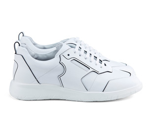 Fashionable modern white leather sneakers isolated on a white background. Modern shoes. Side view.