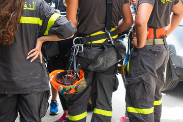 rear view close up of rescue workers at a briefing