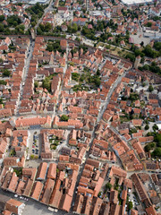 Fototapeta premium ROTHENBURG OB DER TAUBER / GERMANY - JULY 29 2018: Aerial view Rothenburg old town fairy tale german Bavarian city with half-tembered medieval architecture Old street brown roofs houses cityscape.