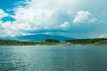blue reservoir and mountain