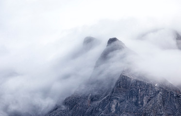 mountain Zugspitze peaks in fog