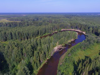 Bend of the Ropcha river in coniferous forest, Komi Republic, Russia. View from top
