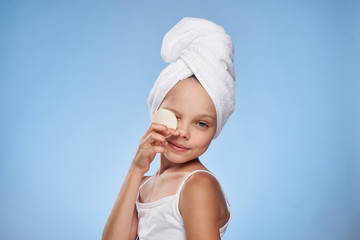 girl with a towel on her head cotton pads skin care lifestyle hygiene