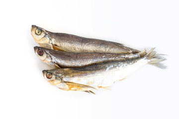 isolated close up top view three dried salted chehon fish on a white background