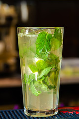 Mojito cocktail on dark background. Close-up, selective focus