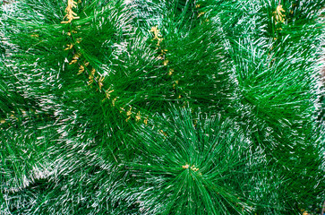 Naklejka na ściany i meble spruce artificial branches, green needles with silver tips for backdrop and background
